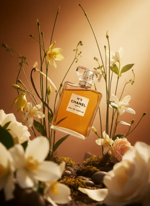 Product Levitation Display Floating perfume, golden light, lush bokeh